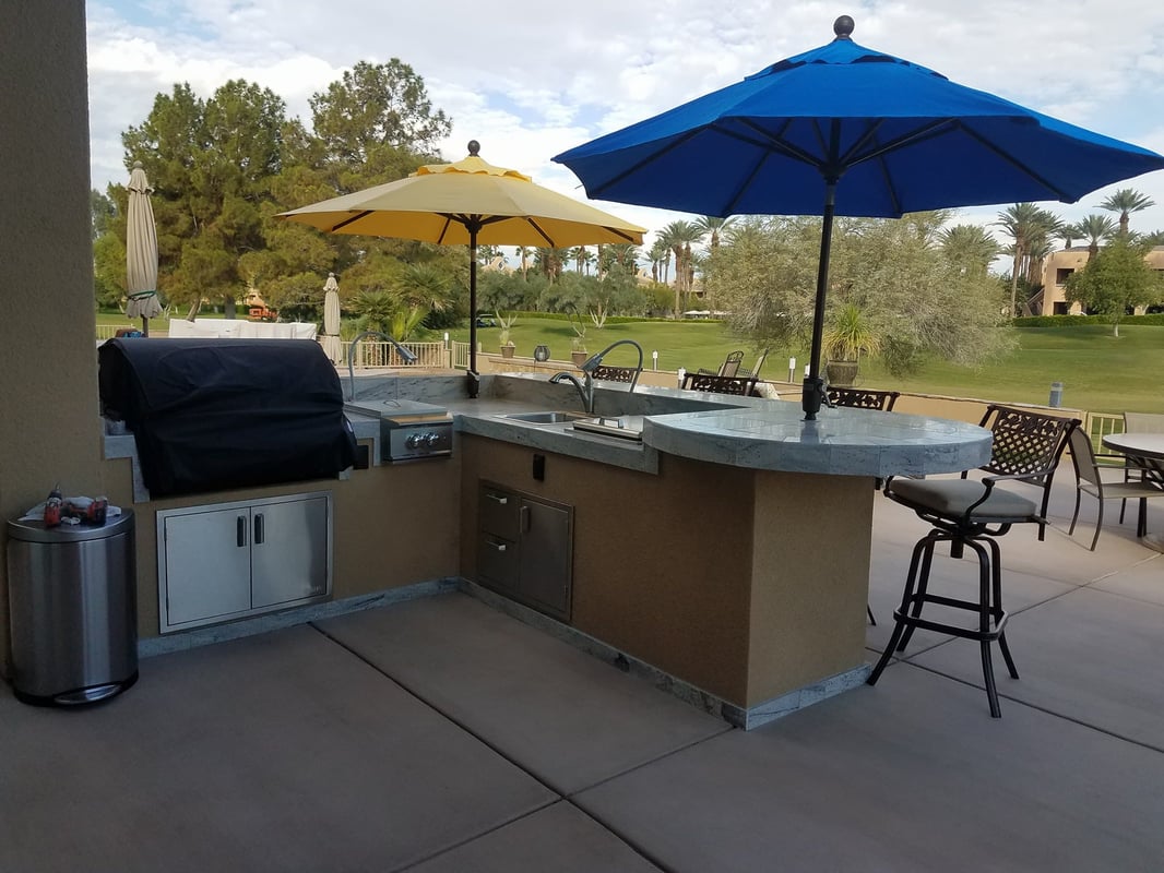 Custom outdoor kitchen island overlooking a Coachella Valley golf course